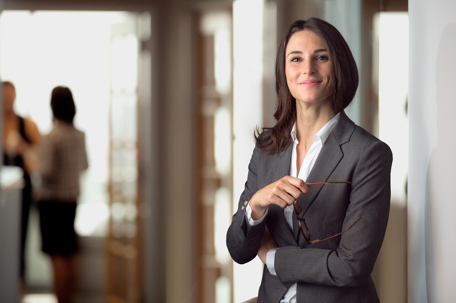 McGrath Law Firm Mount Pleasant Lawyer joyfully smiling with glasses in her hand