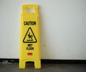 Caution Sign leaning up against the wall - McGrath Law Firm - Slip and Fall Accident - Mount Pleasant, SC
