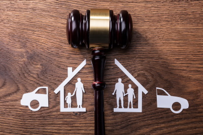 An Image of a House with a Family that is divided; a woman and a child and a man and a child. McGrath Law Firm, Divorce Lawyers, Mount Pleasant, S.C.